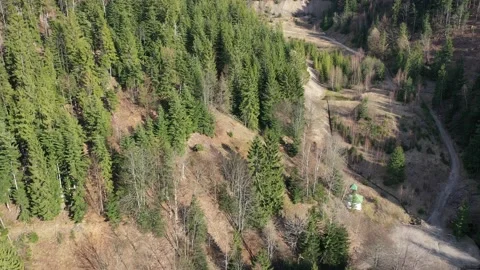 Flight towards and around old surface copper ore deposit in mountains Stock Footage 137436395