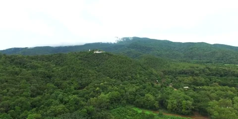 Flight towards Buddha in tha mountain jungle Stock Footage 55924895