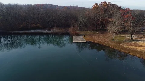 Flight towards an empty dock in a pond Stock Footage 98488918
