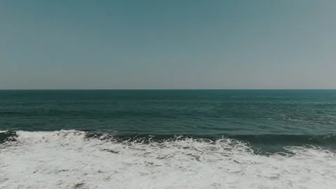 Flight towards Pacific Ocean with white waves Stock Footage 333204426