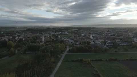 Flight towards a small village on a cloudy morning Stock Footage 171219521
