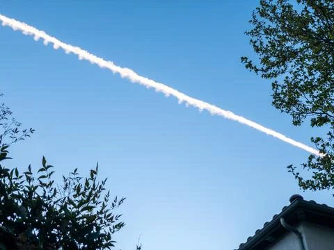 Flight trajectory on the blue sky 写真素材