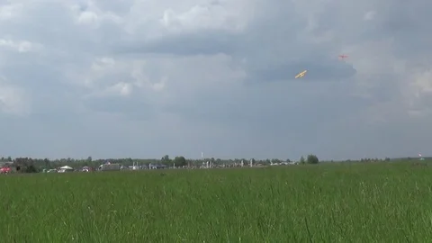 Flight of two motor planes over the airfield Stockbeeldmateriaal 75361976