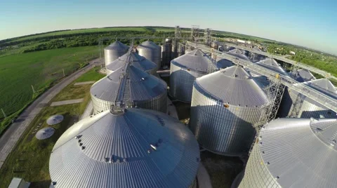 Flight under granaries and elevators in summer - aerial survey Video stock 51618572