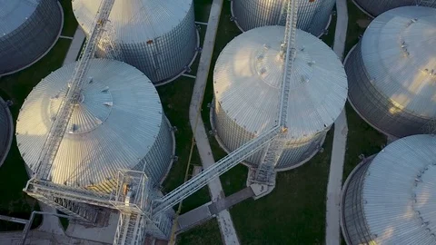 Flight under granaries and elevators in spring Stock Footage 75300125
