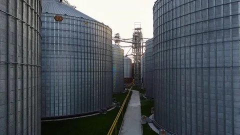 Flight under granaries and elevators in spring Stock Footage 75300155