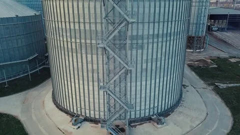 Flight under granaries and elevators or oil storage on autumn background Stock Footage 81595714