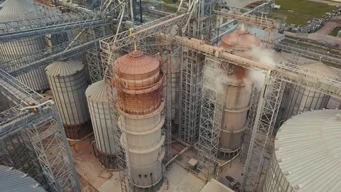 Flight under granaries and elevators or oil storage on autumn background Stock Footage 82103982