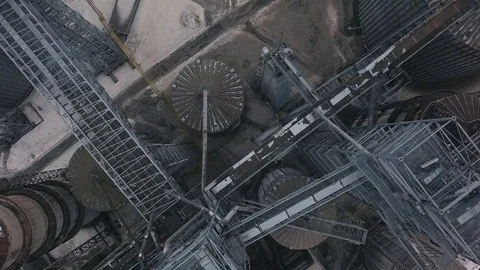 Flight under granaries and elevators or oil storage on winter background Stock Footage 88410675