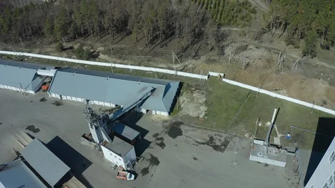 Flight under granaries and elevators in summer - aerial survey. Stock Footage 127658338