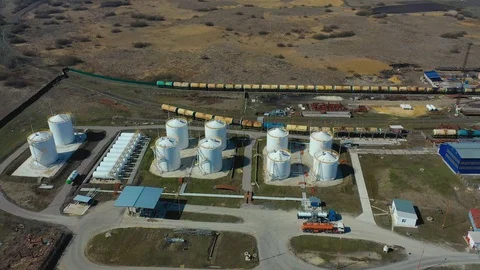 Flight under granaries and elevators with trucks and a station with access roads 스톡 동영상 127706498