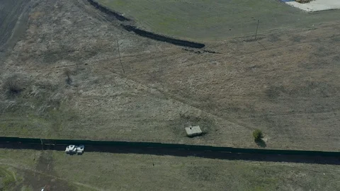 Flight under granaries and elevators with trucks and a station with access roads Stock Footage 127709945