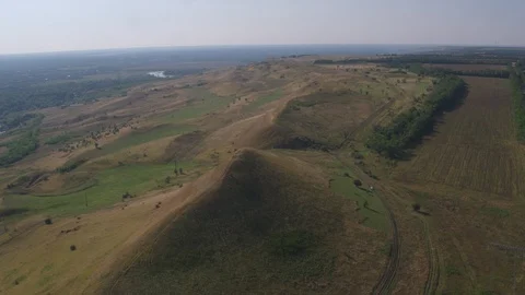 Flight under hills Stock-Footage 94724905