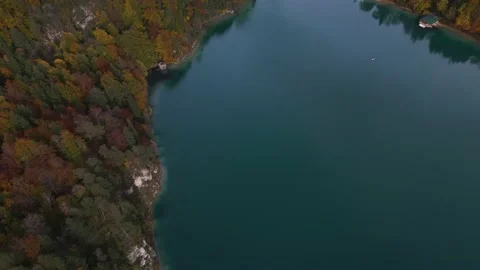 Flight under the lake Alpsee with a view of the Hohenschwangau castle Stock Footage 223266576