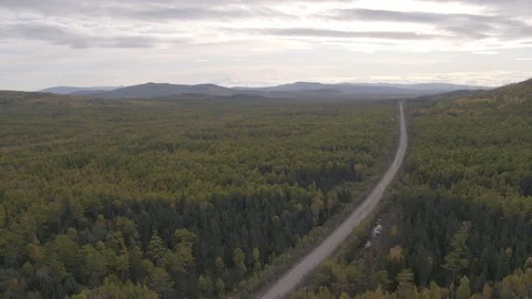 Flight under mountain forest 動画素材 94723403