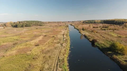 Flight under the river in the countryside. Stock Footage 136787429