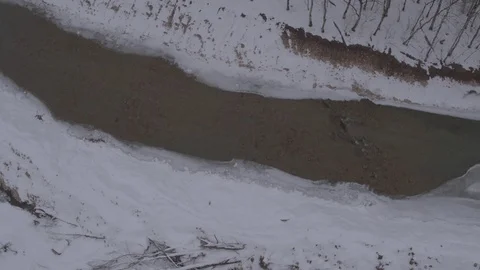 Flight under winter river and forest Stock-Footage 94724487