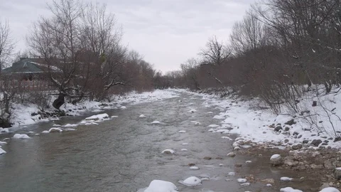 Flight under winter river and forest Video stock 94724819