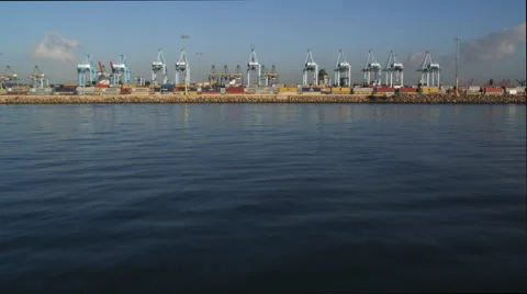 Flight from water level passing over shipping terminal at Los Angeles Harbor. Stock Footage 59113478