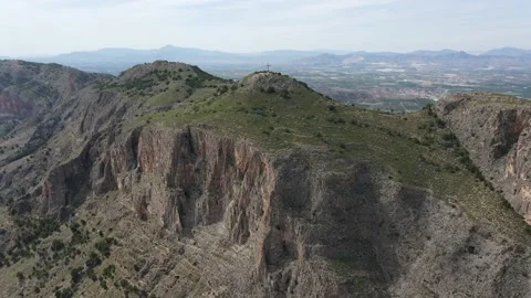 Flight west to the summit cross of Mount Muela near Orihuela in Spain. Stock Footage 132553192
