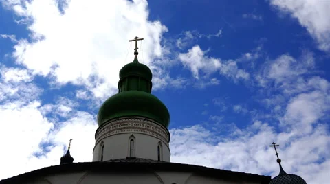 Flight of white clouds on a blue sky over the crosses and domes Stock Footage 68067473
