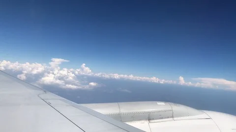 In flight window cloudy blue sky view 04 Stock Footage 104031984