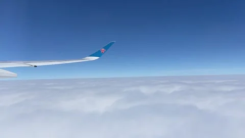 Flight wing flying above clouds, China Southern Airlines, Jan 16, 2025 Video stock 302474347