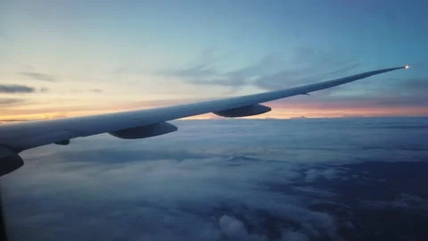 Flight Wing Window Aerial Airplane Sunrise 4K Stock Footage 154602174
