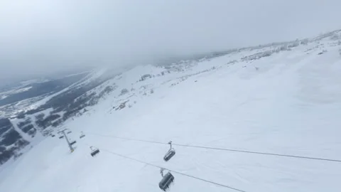 Flights on the FPV drone are close with a new chairlift Stock Footage 187675911