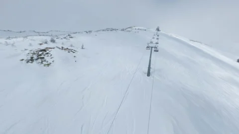 Flights on the FPV drone are close with a new chairlift Stock Footage 187698651