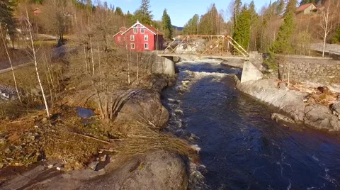 Flights over Norway rough river bridge and the house Stockbeeldmateriaal 63505082