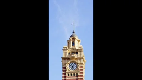 Flinders Street Station Clock Tower Under Blue Sky Stock Footage 324693173