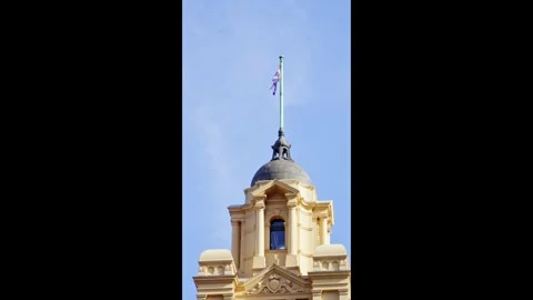Flinders Street Station Clock Tower Under Blue Sky Video stock 324693176
