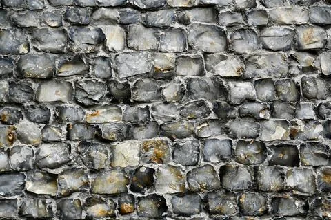 Flint blocks in a wall for use as a background texture Stock Photos