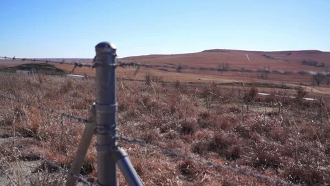 Flint Hills barbed wire next to interstate Stock Footage 72721578