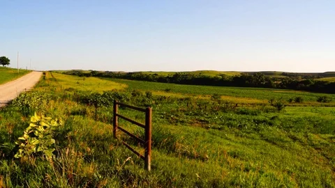 Flint Hills iron gate and road with pasture Stock Footage 91752653