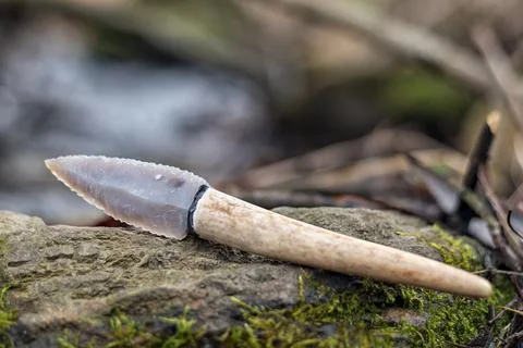 Flint knife - stone age tool in nature Stock Photos