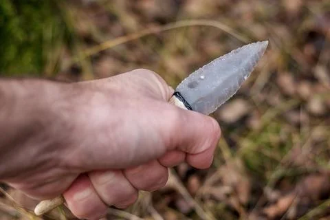 Flint knife - stone age tool in palm Stock Photos
