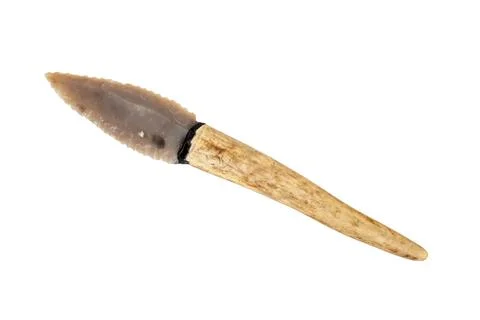 Flint knife - stone age tool - leaf blade in deer antler isolated on white .. Stock Photos