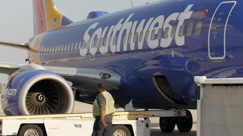 FLINT, MICHIGAN - CIRCA 2017: Ground Crew Loads Up Airplane With Baggage Stock Footage 124767280