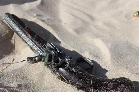 Flintlock Pistol in Sand Stock Photos