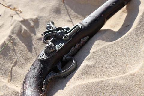 Flintlock Pistol in Sand Stock Photos