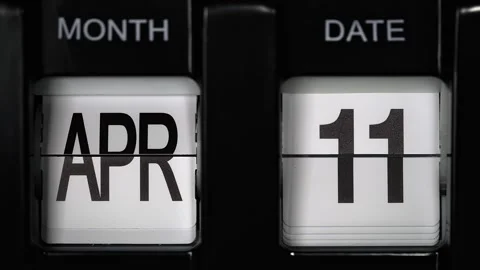 Flip calendar with date change from eleventh of April to twelfth April. close up Stock Footage 266368698