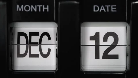 Flip calendar with date change eleventh December to twelfth December. close up. Stock Footage 273529675