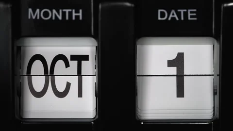 Flip calendar with a date change from first October to second October. close up. Stock Footage 270853444