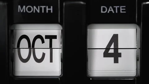 Flip calendar with a date change from fourth October to fifth October. close up. Stock Footage 270853449