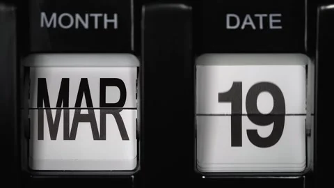 Flip calendar with date change from nineteenth March to twentieth March close up Stock Footage 265749783
