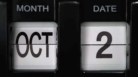 Flip calendar with a date change from second October to third October. close up. Stock Footage 270853445