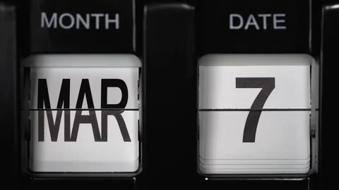 Flip calendar with date change from seventh of March to eighth of March close up Stock Footage 265366539