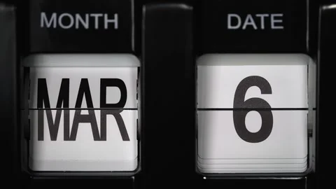 Flip calendar with date change from sixth of March to seventh of March. close up Stock Footage 265366548